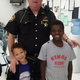 Butler County Sheriff’s Deputy Brian Bussell poses with the two small children of the woman he helped out.
Butler County Sheriff’s Office via the Cincinnati Enquirer